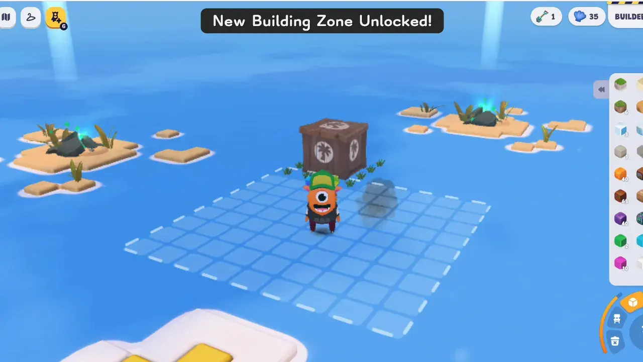 A small private island in open water with new ground appearing after a build zone unlock.
