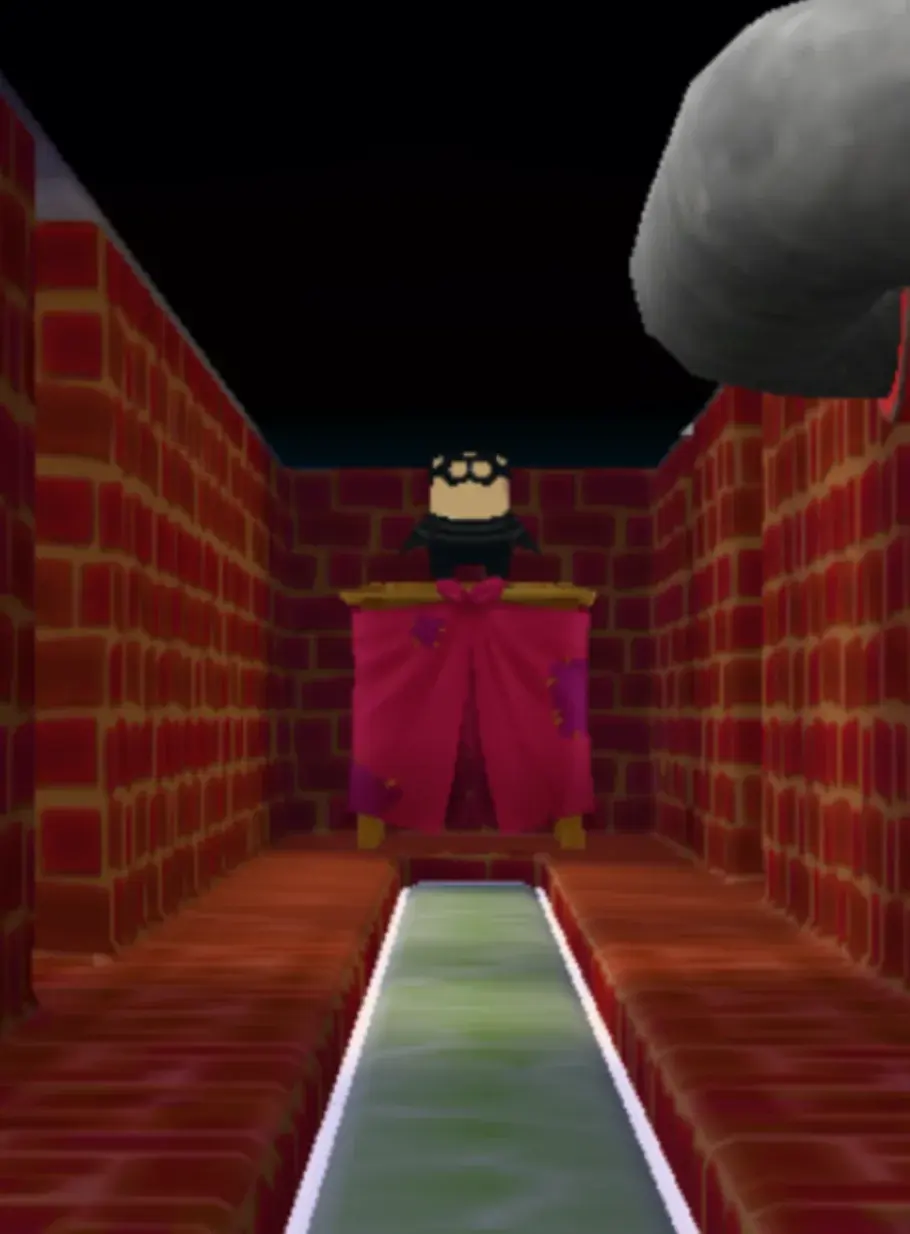 A dark brick corridor leading to a changing station at the far end.