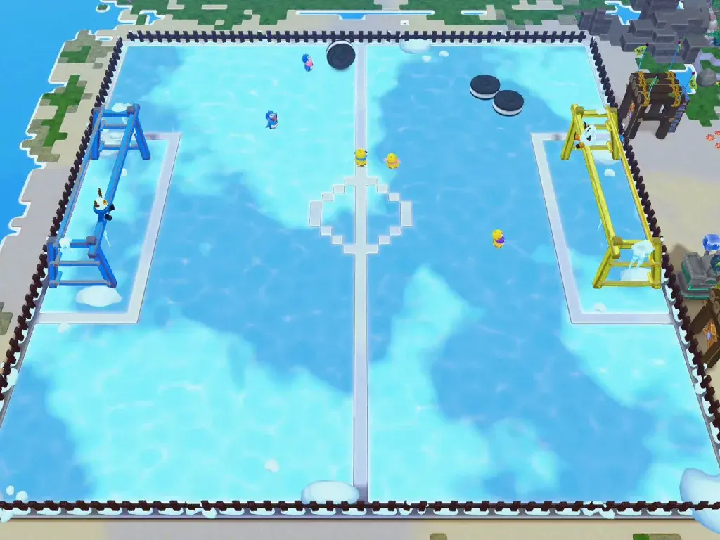 An overhead view of the penguin hockey rink with blue and yellow goals.