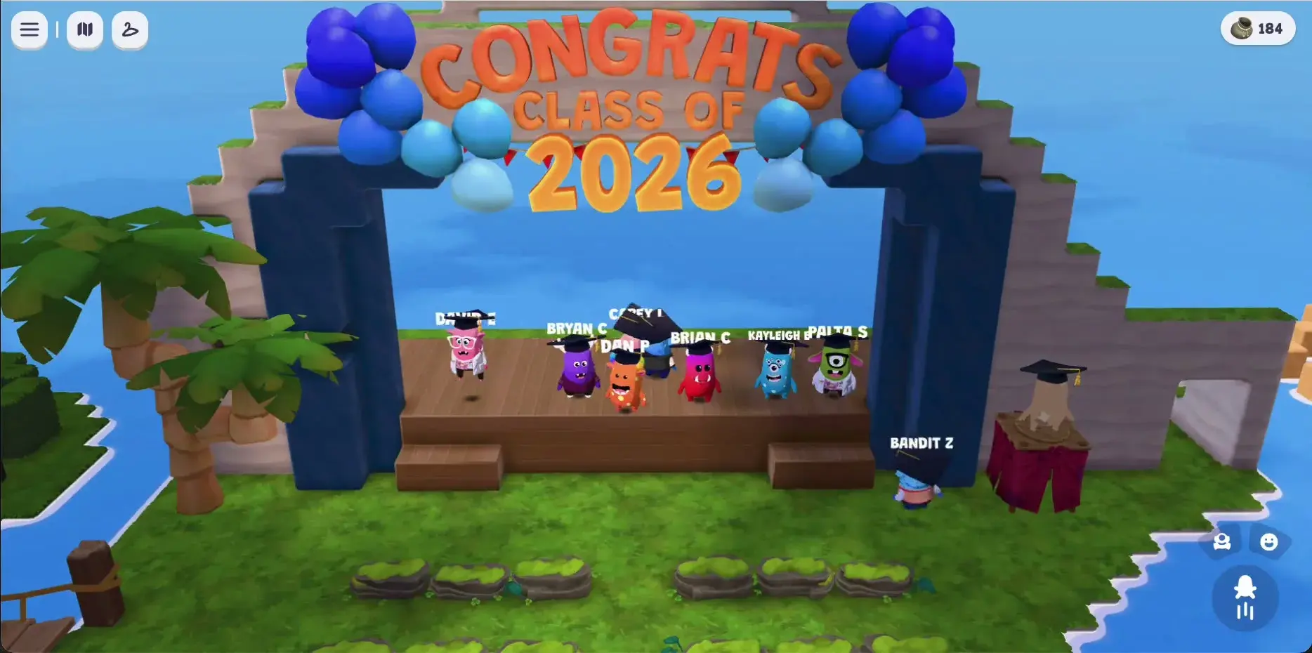 The graduation stage on Dojo Islands. Seven characters in graduation caps lined up across a wooden stage under a CONGRATS CLASS OF 2026 balloon archway.